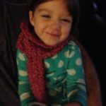 Lola snuggled in with her new scarf. Baby it's been cold outside!